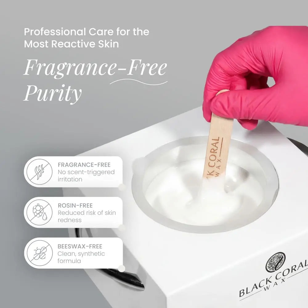A hand in a pink glove holds a wooden spatula with hard wax over a wax warmer. Text highlights “Fragrance-Free Purity” for sensitive skin: fragrance-free, rosin-free, beeswax-free. White Coral Wax by Black Coral Wax USA logo is shown.
