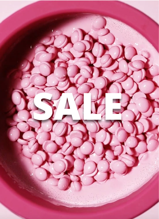 A pile of pink wax beads in a pink bowl, with the text SALE in bold white letters across the center.