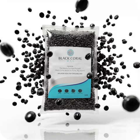 A bag of Black Coral Wax USA’s Black Coral Hard Wax (Free Gift) is surrounded by loose black wax beads suspended in the air against a white background, with the package prominently displaying the product information and branding.