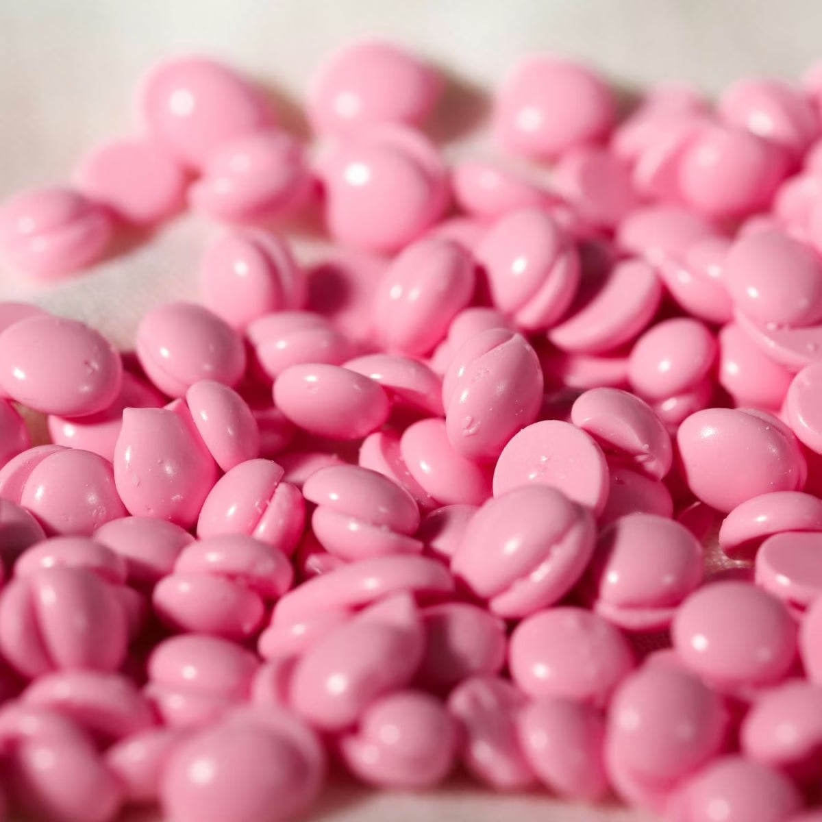 pink hard wax beads from black coral wax