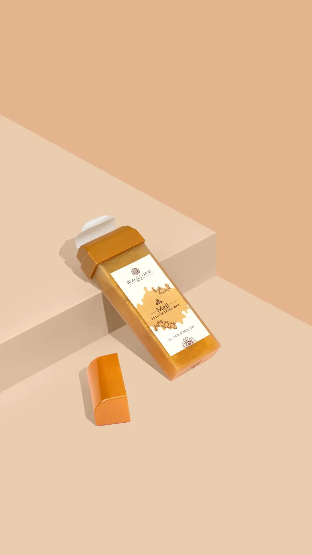 A rectangular Meli Roll-On SpeedWax by Black Coral Wax USA with a white cap and honeycomb label rests on a beige surface beside its orange cap, set against a peach background—ideal for gentle waxing.