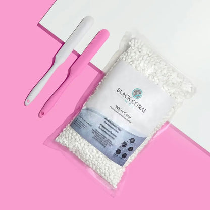 Bag of white coral with a white tool on a pink background