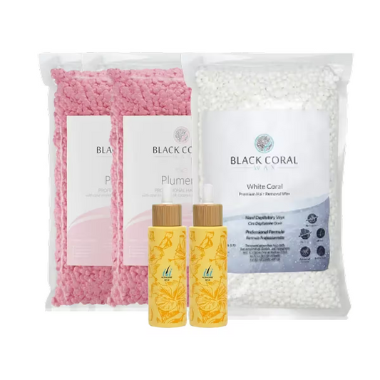 The BCW Brazilian Master Kit by Black Coral Wax USA includes two large bags of pink and white hard wax beads and two small yellow floral bottles—ideal for a smooth, professional Brazilian or intimate waxing experience.