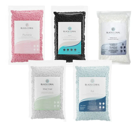 Five 5lb bags of Black Coral Wax USA’s “Wax Of Your Choice” in assorted colors—pink, black, white, light gray, and light blue—each labeled and shown on a white background for a polished hard wax-inspired look.
