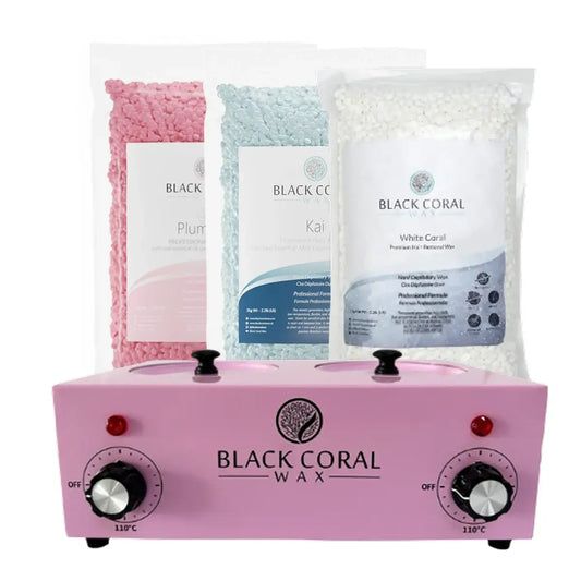 The Black Coral Wax USA Starter Waxing Kit features a pink double wax warmer with two dials and includes three bags of hard wax beads—Plum, Kai, and White Coral—for smooth results.