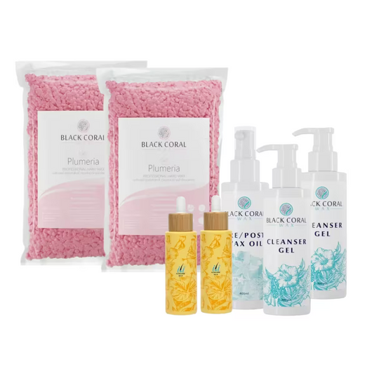 The Black Coral Wax USA Sensitive Skin Kit includes a professional waxing set with gentle hard wax, pink Plumeria bath salts, floral dropper bottles, and cleanser gel and pre/post wax oil in pump bottles.