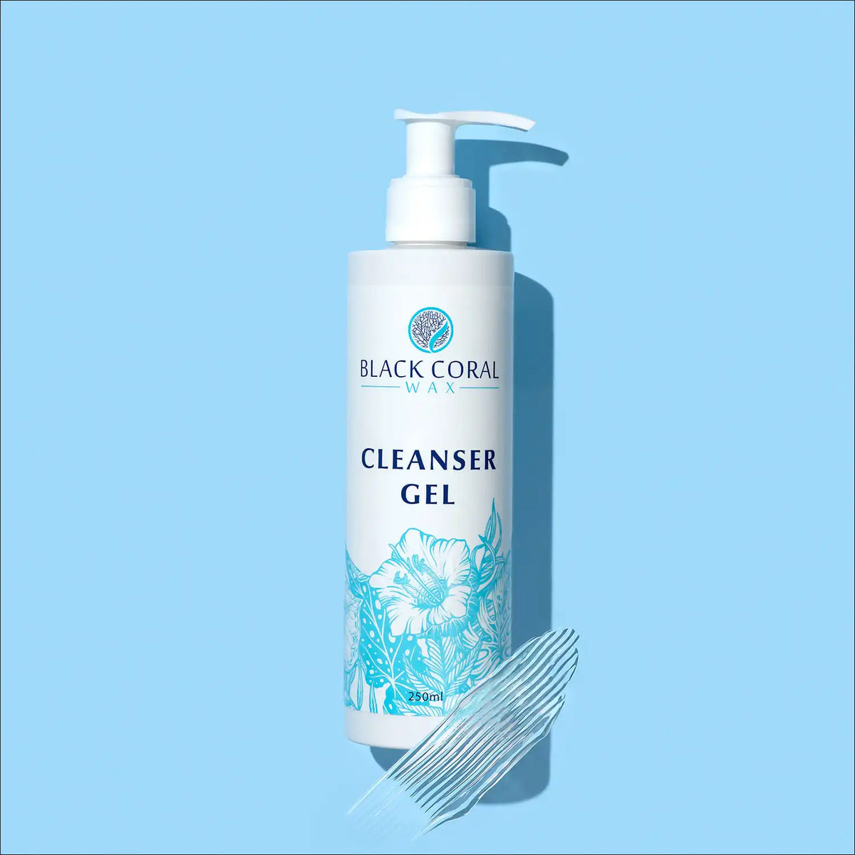 A 400ml bottle of Black Coral Wax USA Cleanser Gel with a pump top, featuring a blue floral design, sits on a light blue background alongside a smear of clear gel—ideal for pre-waxing cleansing routines or as part of your post-waxing care.