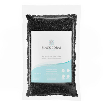 A sealed Black Coral Hard Wax pack from Black Coral Wax USA is shown. The transparent bag displays black beads, with a white label featuring the logo and text on its stripless wax formula for lasting hair removal, plus detailed usage directions.