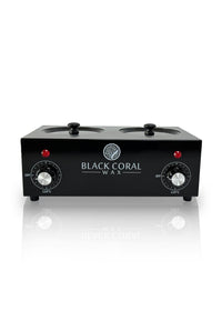 The Double (2x1lb) Wax Warmer by Black Coral Wax USA features two clear-lidded pots with silicone inserts, dual temperature control knobs, red indicator lights, and the brand’s logo on the front, shown against a white background.