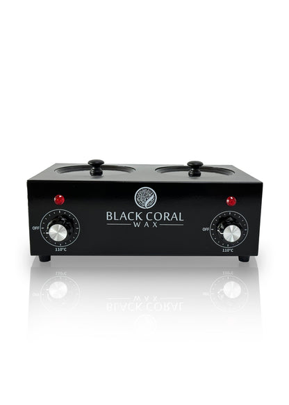 The Double (2x1lb) Wax Warmer by Black Coral Wax USA features two clear-lidded pots with silicone inserts, dual temperature control knobs, red indicator lights, and the brand’s logo on the front, shown against a white background.