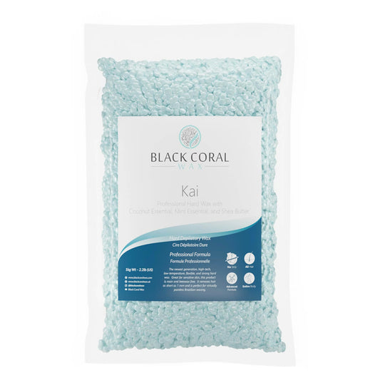 Close-up of Black Coral Wax USA Kai Hard Wax beads in shades of turquoise blue, displayed in a clear bag with branding visible on the packaging. - opakowanie kai 
