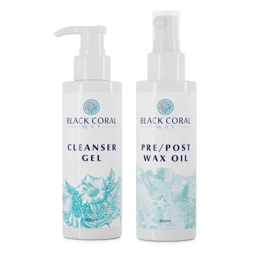 Two white pump bottles labeled Pre/Post Wax Care KIT by Black Coral Wax USA, featuring teal floral and sea-inspired designs.