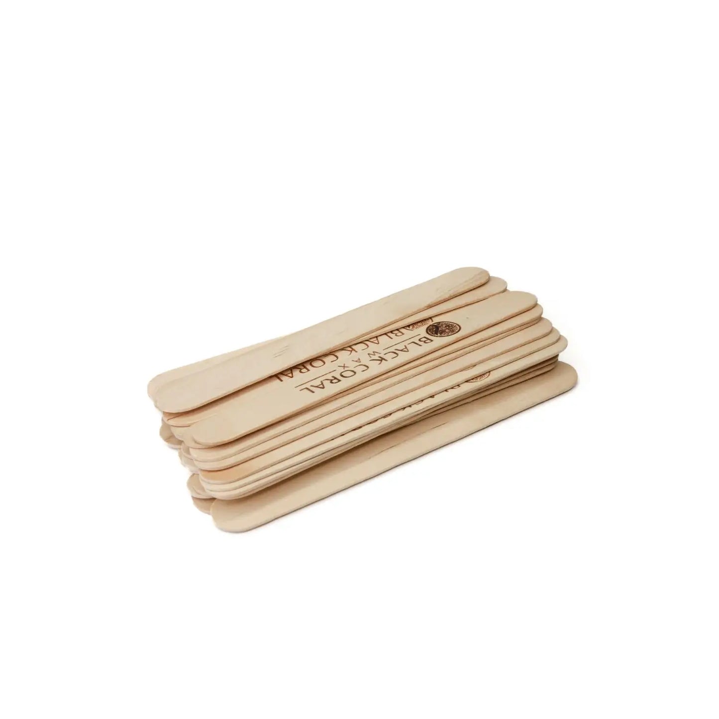 A small stack of light brown Wooden Waxing Sticks by Black Coral Wax USA is neatly aligned against a white background, with one stick featuring a printed logo. Ideal for professional waxing or crafts.